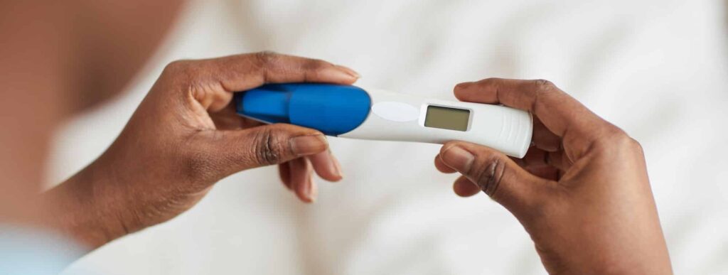 Unrecognizable Woman Holding Pregnancy Test